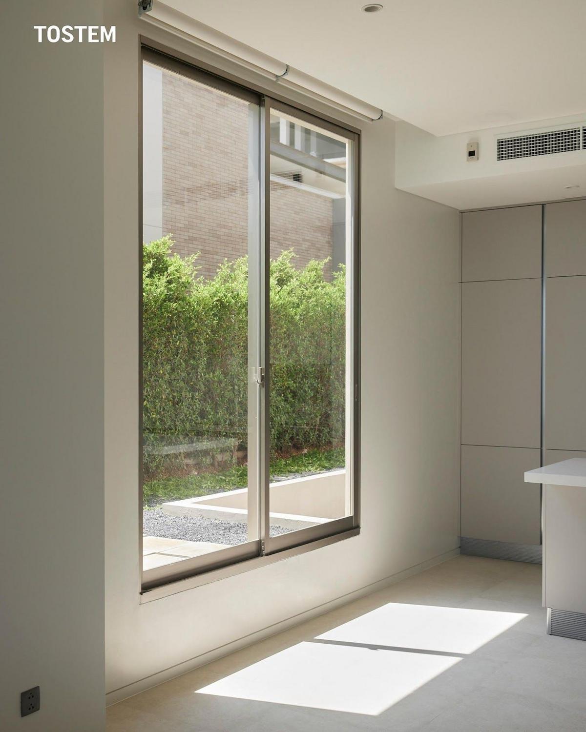 A sleek aluminum door design creates stylish home entrances.