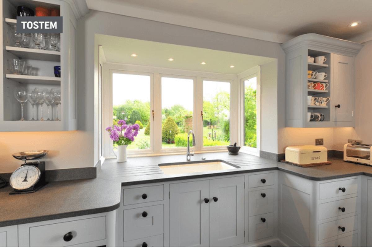 Aluminum-glass window brightening the kitchen space with window material types