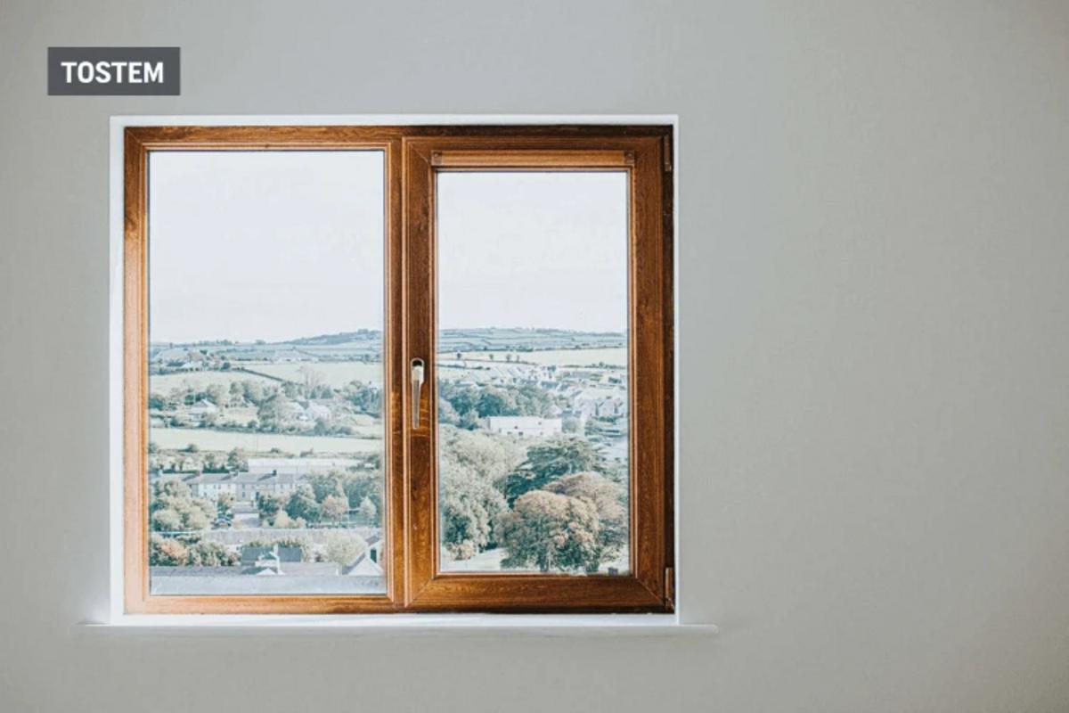 Beautiful 2-panel wood-framed casement top window design.