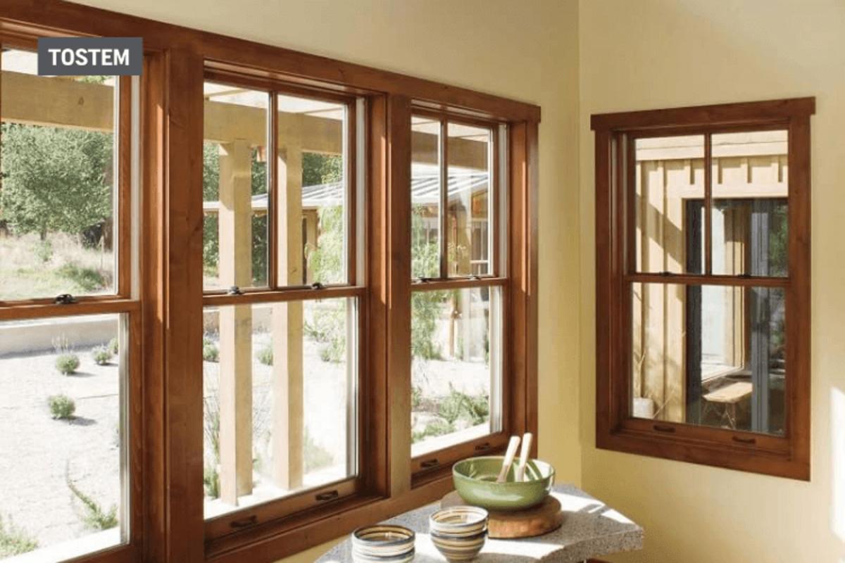 Glass windows with wooden frames in brown tone using window material types