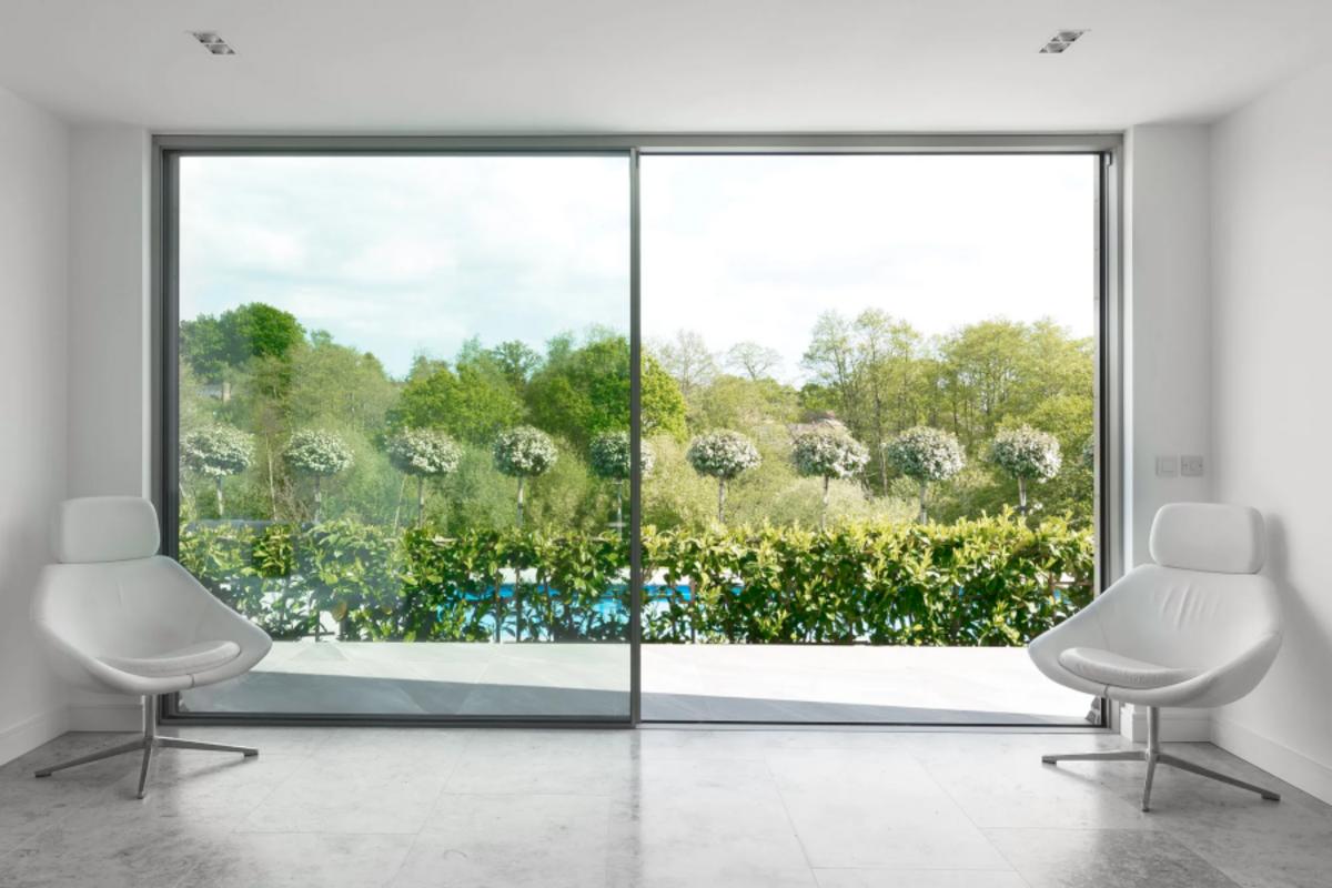 Large 2-panel aluminum glass sliding glass door design brings natural light.