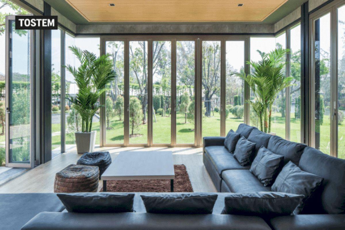 Large aluminium double door design elevates villa living rooms.
