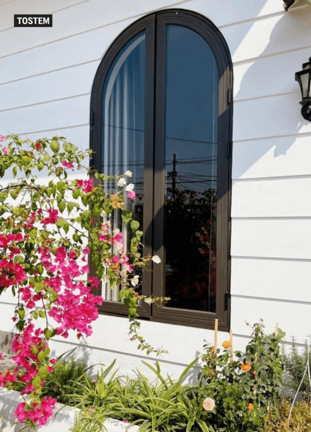 Popular aluminium glass arch window design in India for modern homes.
