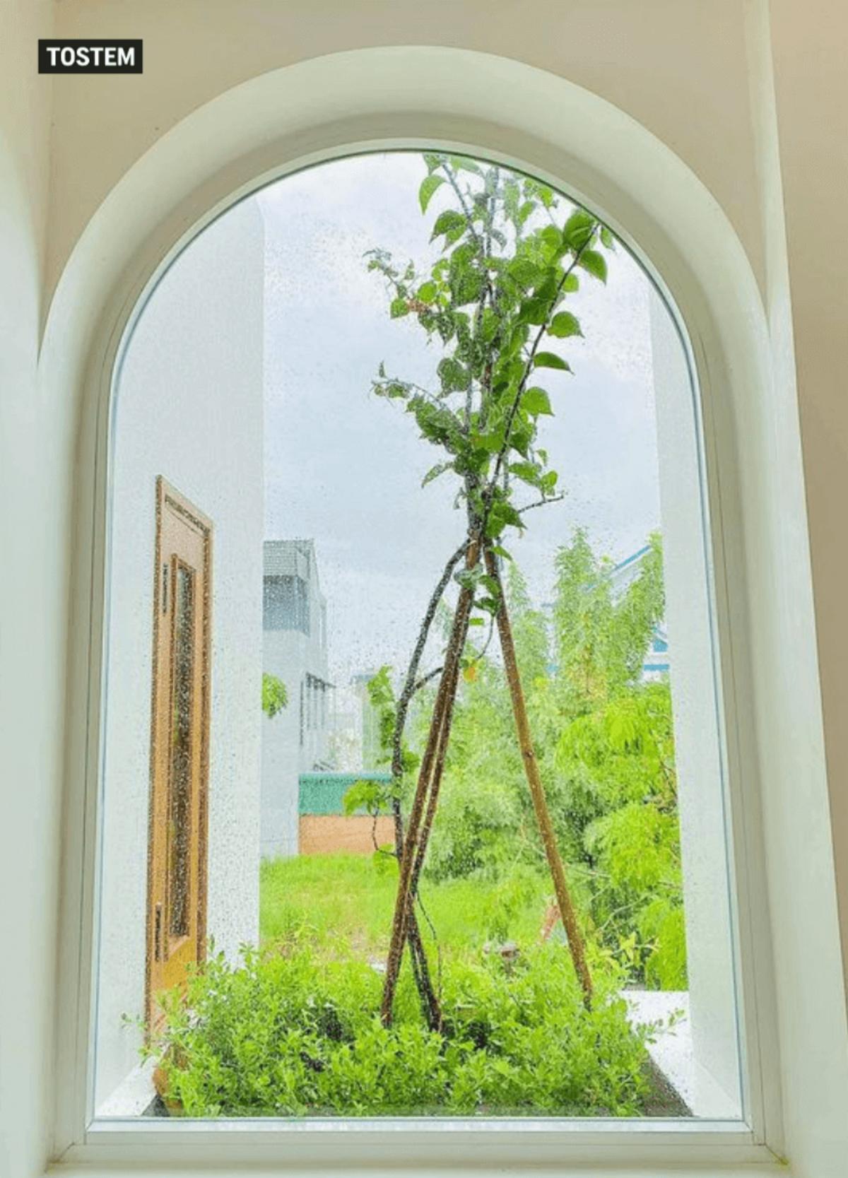 Simple aluminium glass partition with arch window design in India.
