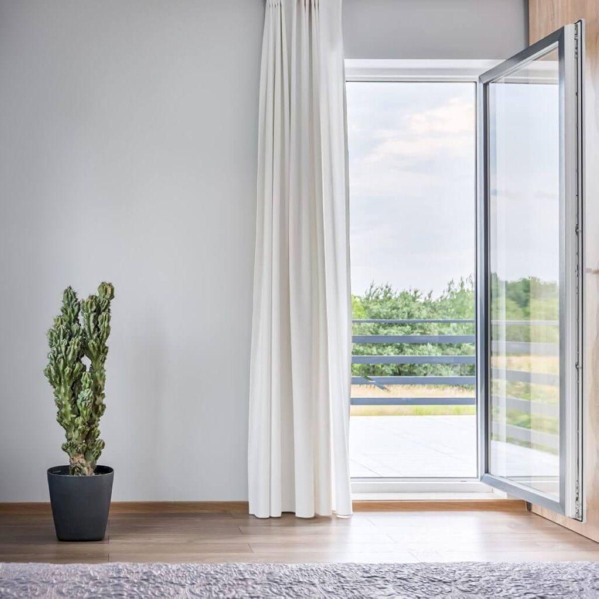 Single aluminium door design saves space in small rooms.