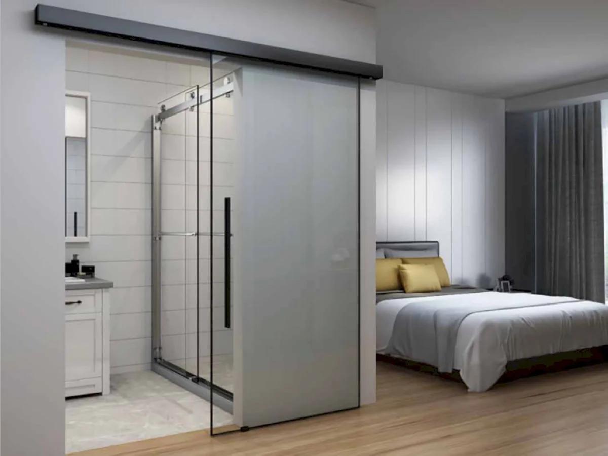 Single-panel aluminium sliding door with clear glass at modern ceramics vile parle