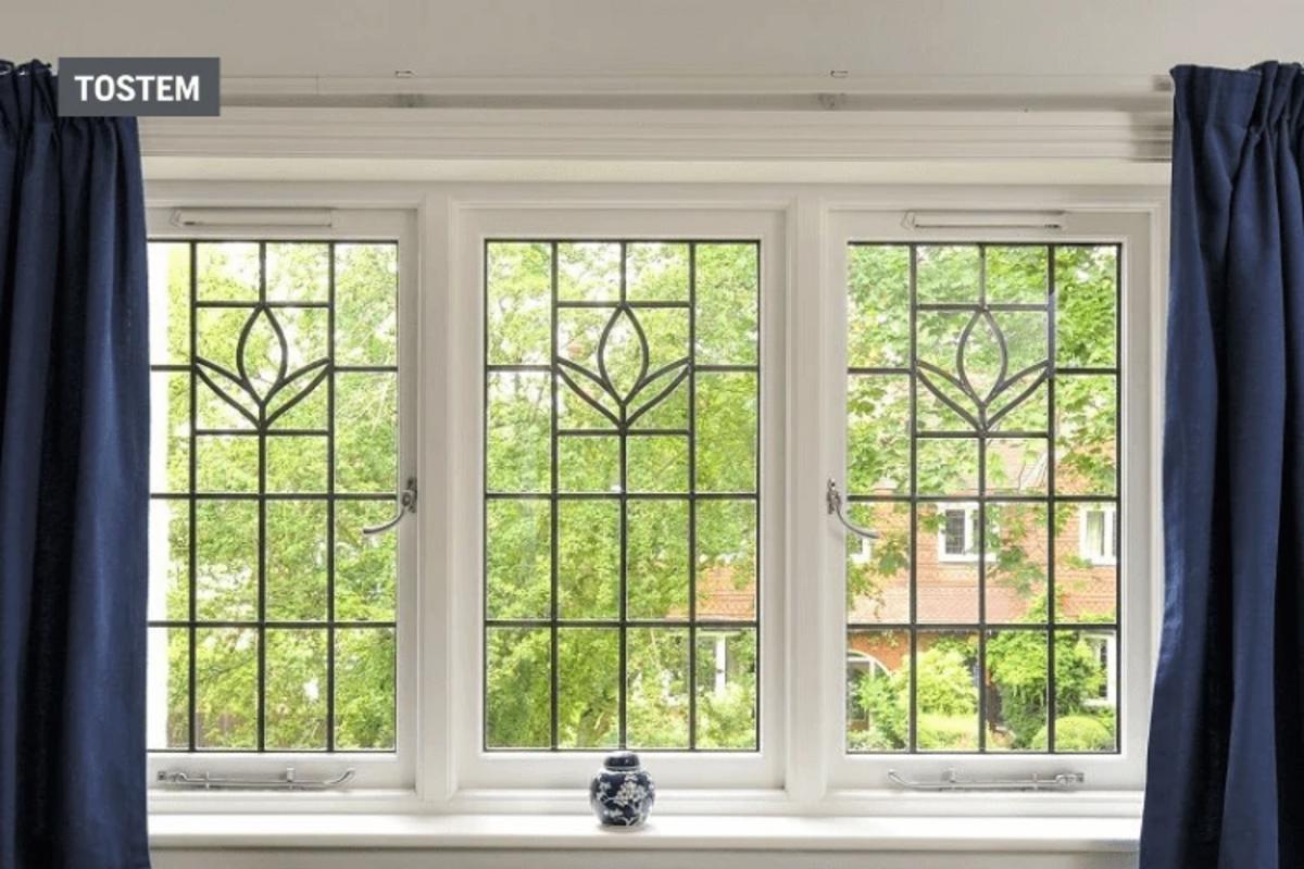 Three-panel wrought iron door plus window design with grille.